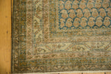 Distressed Malayer rug corner showing texture, faded apricot, brown, and dusty blue Mir boteh.