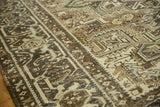 Vintage Distressed Heriz rug border showcasing geometric turtle motifs and time-softened pile.