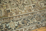 Textured worn pile of vintage Heriz carpet showing geometric turtle border and field.