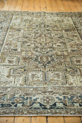 Distressed Heriz geometric pattern with brown, ivory, slate gray tones and worn texture.