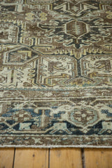 Distressed Heriz carpet border with classic turtle/samovar motif in browns and ivory.