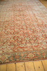 Distressed vintage Heriz rug border detail, featuring dusty seafoam green and madder red palette.