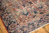 Vintage Heriz carpet corner detail, with traditional floral patterns and mostly even pile wear.