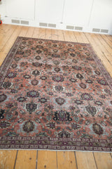 Distressed vintage Veramin carpet showcasing faded copper, burgundy allover pattern and worn pile.