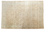 Distressed vintage Sparta carpet with low pile, an ivory field, and blue-accented vinery, 7'3
