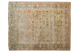 Distressed vintage Afshar rug with dusty rose, sage, and ivory geometric florals, 4'11