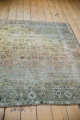 Distressed vintage Afshar rug border with worn pile and geometric patterns in dusty sage, slate blue.