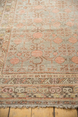 Distressed vintage Khotan carpet section, worn pomegranate motif, silver, pale red, foundation showing through, geometric border.