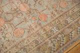 Vintage distressed Khotan rug: worn pile texture, pomegranate design in silver, red, brown.
