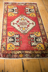 Vintage Oushak rug corner showing saffron, ivory, dark brown germinating planter design.