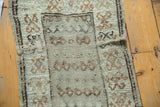 Vintage distressed Oushak rug mat with hard etching to foundation and low pile.