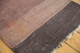 Vintage Turkish Kilim rug with striated mauve and charcoal bands, highlighting hand-woven texture and red threads.