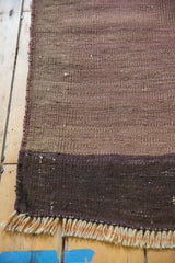 Vintage Turkish Kilim rug end with dark striated eggplant and charcoal bands, fringe.