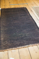 Vintage Turkish Kilim rug, dynamic charcoal texture, visible wefted weave, natural fringe.