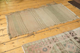 Lower section of vintage Turkish Kilim runner, striped bands, lightly tattered fringes.