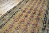 Vintage Malayer runner's dusty gold saffron field with blush and wine red paisley botehs.