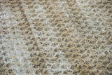 Distressed texture of a Mir Serbend rug, revealing exposed foundation and allover boteh pattern.