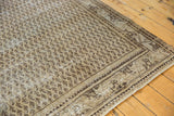 Vintage Distressed Mir Serbend carpet corner, highlighting boteh pattern, wear, and geometric border.