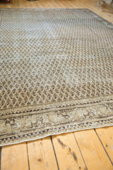 Vintage Distressed Mir Serbend carpet corner, revealing exposed foundation and beige boteh pattern.