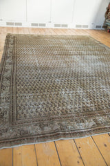 Distressed Mir Serbend carpet corner with allover boteh pattern, worn pile, and exposed foundation.