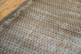 Vintage Mir Serbend carpet border detail, distressed beige field with charcoal boteh pattern.