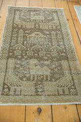 Distressed vintage Sivas runner's pictorial village life motif in beige and bronze.