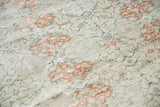 Vintage distressed Sivas carpet showing isolated wear, exposed foundation, and faded terracotta design.