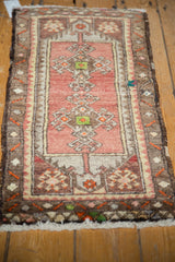 Dusty blush rose and chocolate brown double medallion Oushak rug with rams horn motifs.