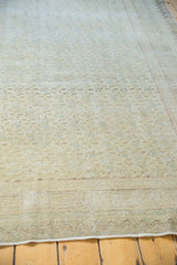 Distressed vintage Kayseri carpet with light foundation showing and faded floral pattern.