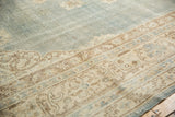 Faded denim blue and ivory Sivas carpet border, with even wear and scrolling arabesque details.