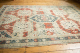 Visible abrash, red distressed texture, and teal geometric motifs on the vintage Sivas border.