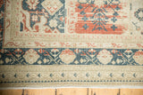 Distressed Sivas carpet border with mallard green, red, ivory curvilinear motifs, aged abrash.