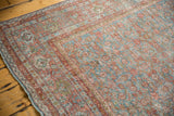 Distressed vintage Mahal carpet, sky blue and blush red Herati pattern, worn texture.