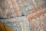 Folded edge and distressed Herati motif of a vintage Mahal carpet in sky blue, blush red.