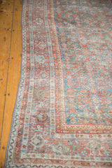 Distressed vintage Mahal carpet border with faded sky blue and blush red Herati pattern.