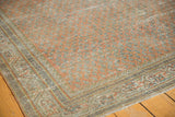 Traditional Serbend border with geometric floral motifs meeting the distressed Mir boteh field at the corner.