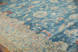 Distressed sky blue field with sprawling vinery joining beige border, showing knot heads.