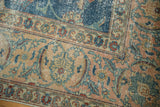 Vintage Distressed Tabriz carpet corner with sky blue field, pale blush vinery, and wear.