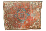 Antique hand knotted Persian Serapi rug with geometric medallion, madder red, and sky blue.