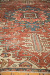 Artistic merit of antique Serapi carpet, revealing hand-knotted texture and warm tonal abrashes.