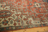 Antique Serapi rug with madder root red, ivory, sky blue geometric and stylized floral motifs.