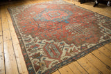 Antique Fragmented Serapi carpet, hand knotted with geometric medallion and rich abrashes.