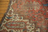 Antique Serapi carpet border detail with geometric patterns, madder red, sky blue, and visible knot wear.
