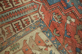Antique Fragmented Serapi carpet section, displaying bold geometric motifs and visible knot wear.