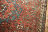 Antique Serapi rug corner detail showing geometric patterns, soft abrashes, and visible wear.