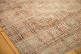 Distressed Bokhara carpet with pale blush, ivory elephant footprint guls and low pile.
