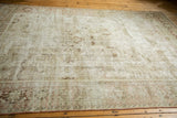 Distressed vintage Mahal carpet, hard wear, exposed foundation, subtle ivory and bronze floral patterns.