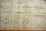 Heavily worn distressed Mahal carpet with exposed foundation and muted patterns.