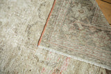 Distressed vintage Mahal carpet displaying hard wear, exposed foundation, and hand knotted reverse.
