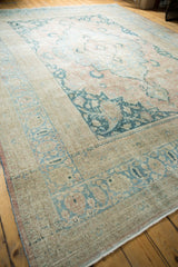 Vintage distressed Khorassan rug corner, with even wear, faint foundation, and pale blue patterns.